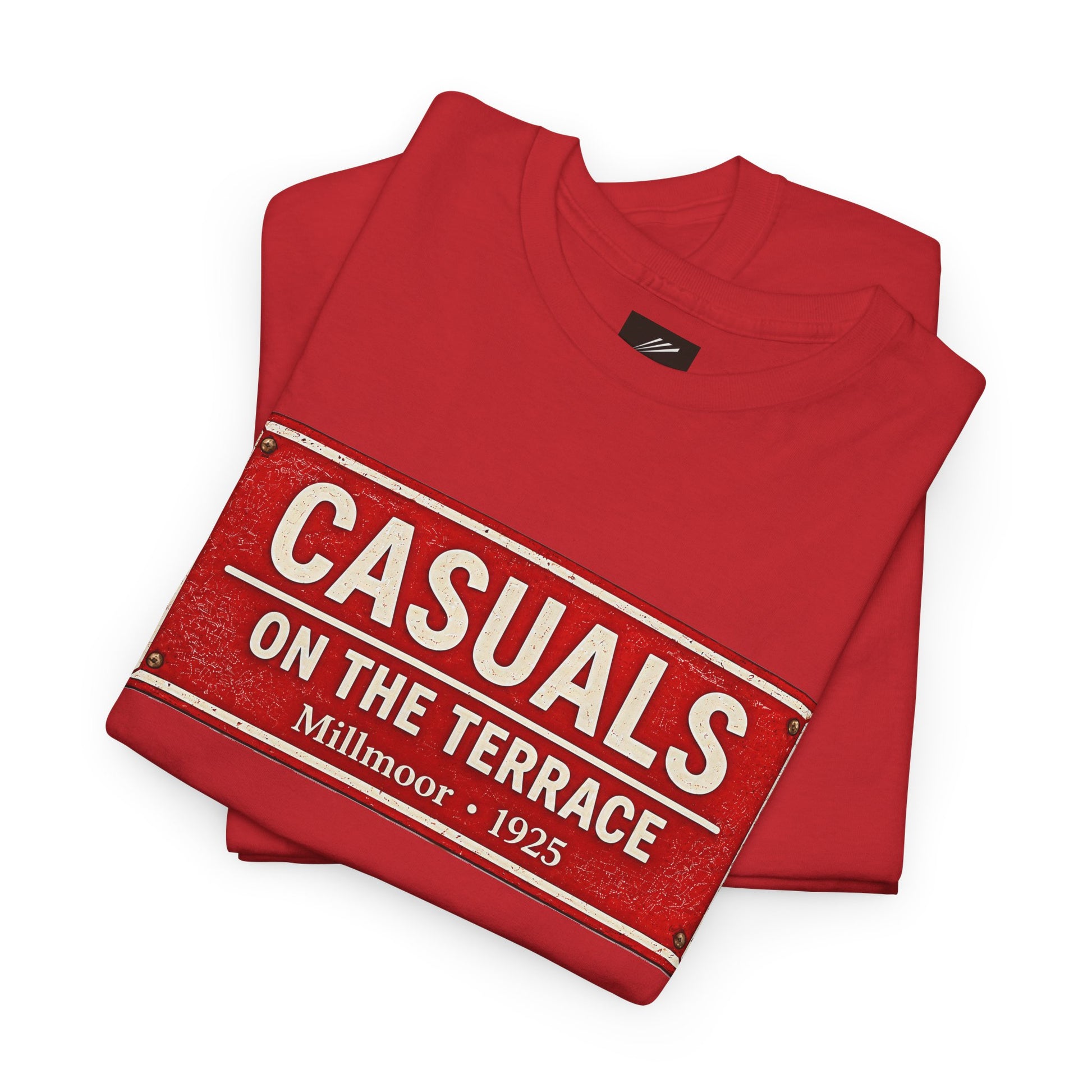 A folded red Rotherham t-shirt featuring a vintage-style red and white sign graphic that reads 'CASUALS ON THE TERRACE Millmoor - 1925'.