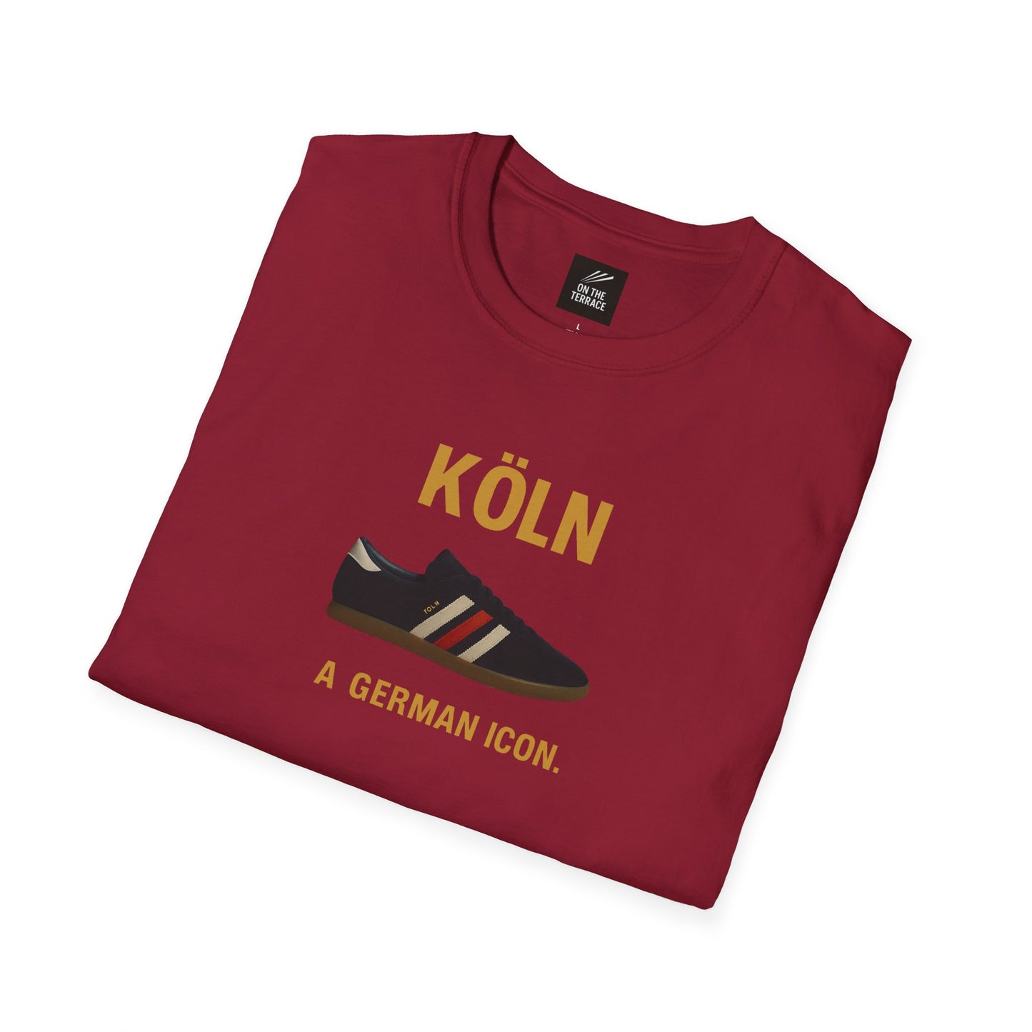 Maroon T-shirt featuring a sneaker graphic and text 'KÖLN A GERMAN ICON.' folded flat