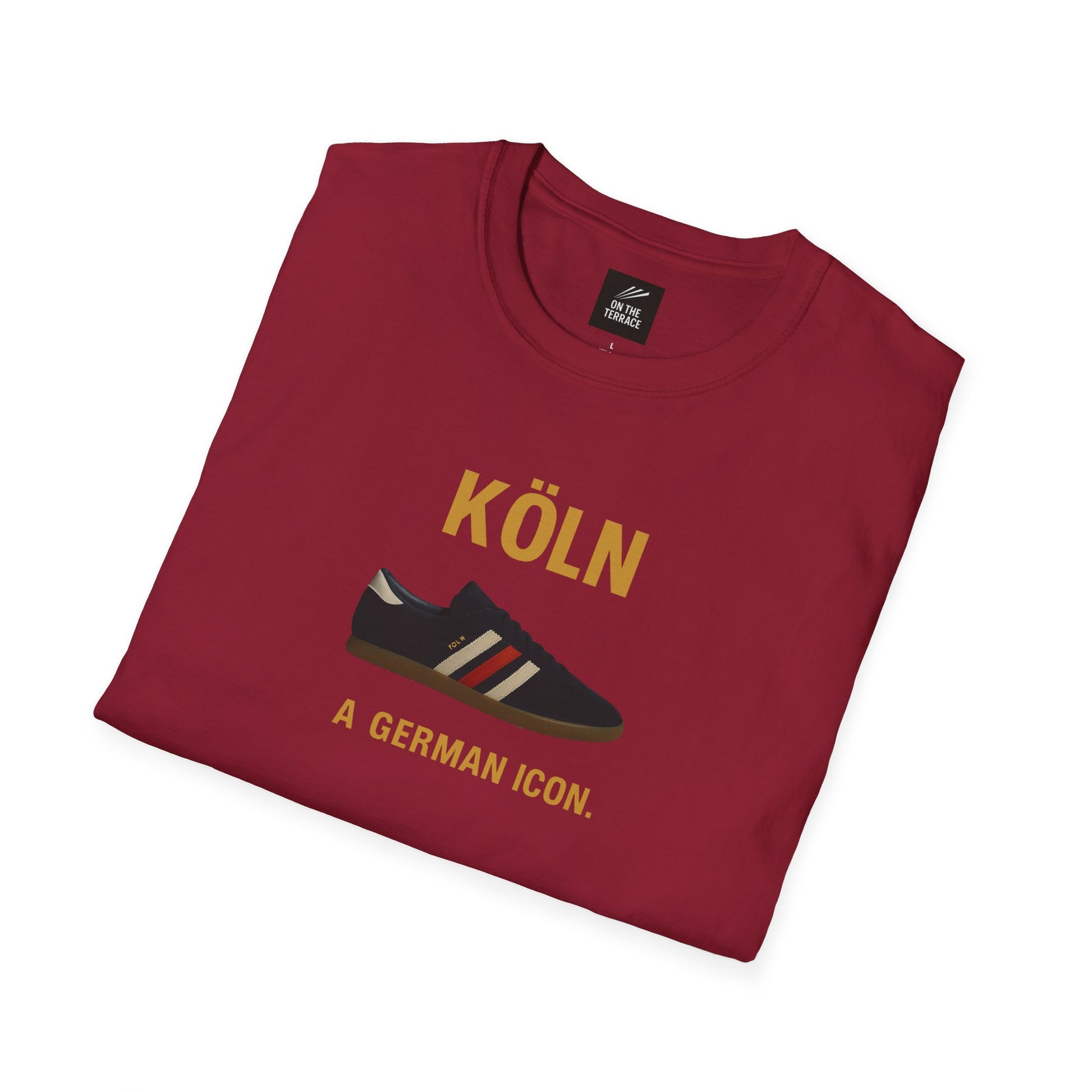 Maroon T-shirt featuring a sneaker graphic and text 'KÖLN A GERMAN ICON.' folded flat