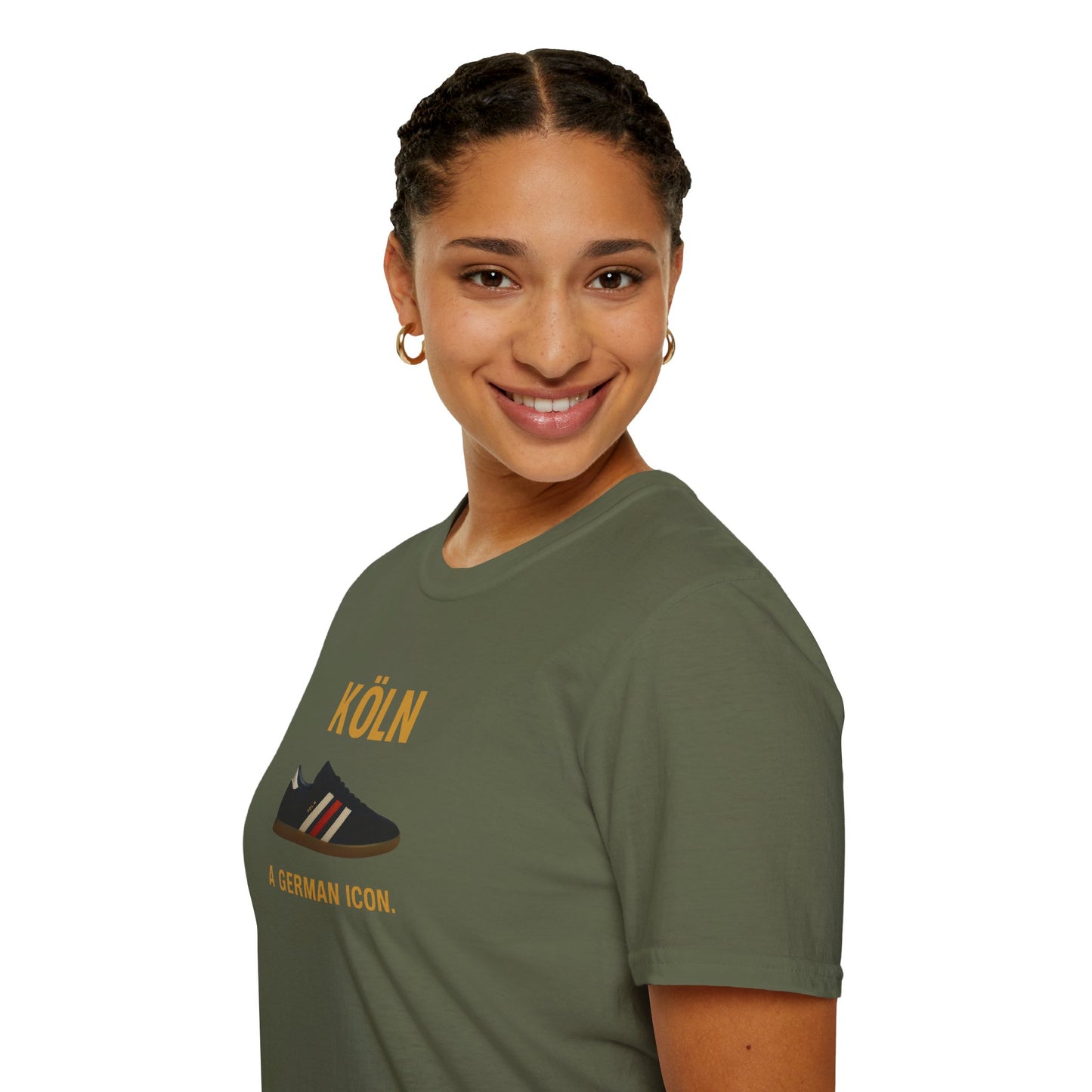 Smiling woman with braided hair wearing an olive green Köln graphic t-shirt with shoe design