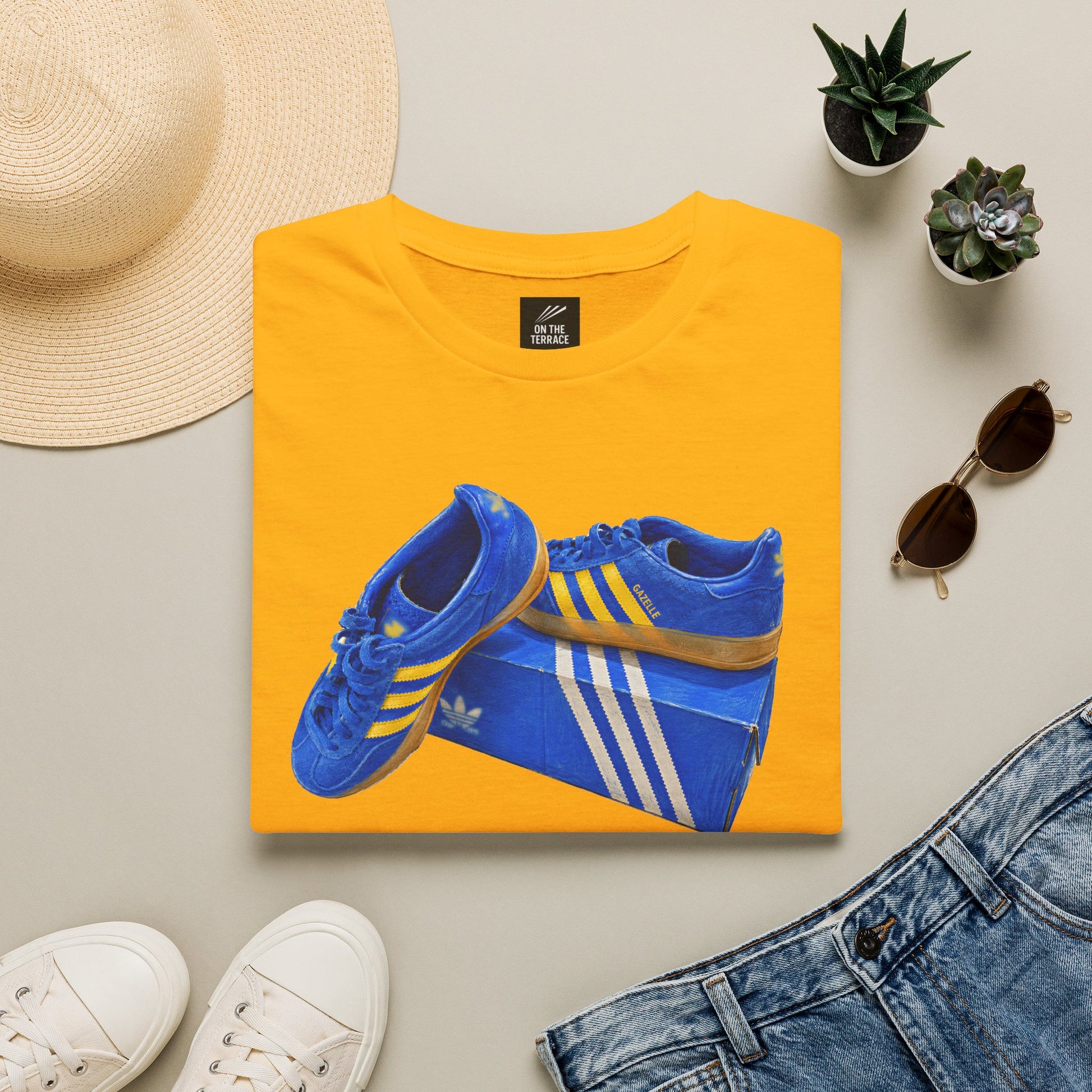 Yellow retro sneaker graphic t-shirt with blue vintage trainer and shoebox print