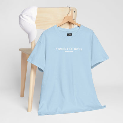 Sky blue Coventry Boys T-shirt on a hanger by a chair