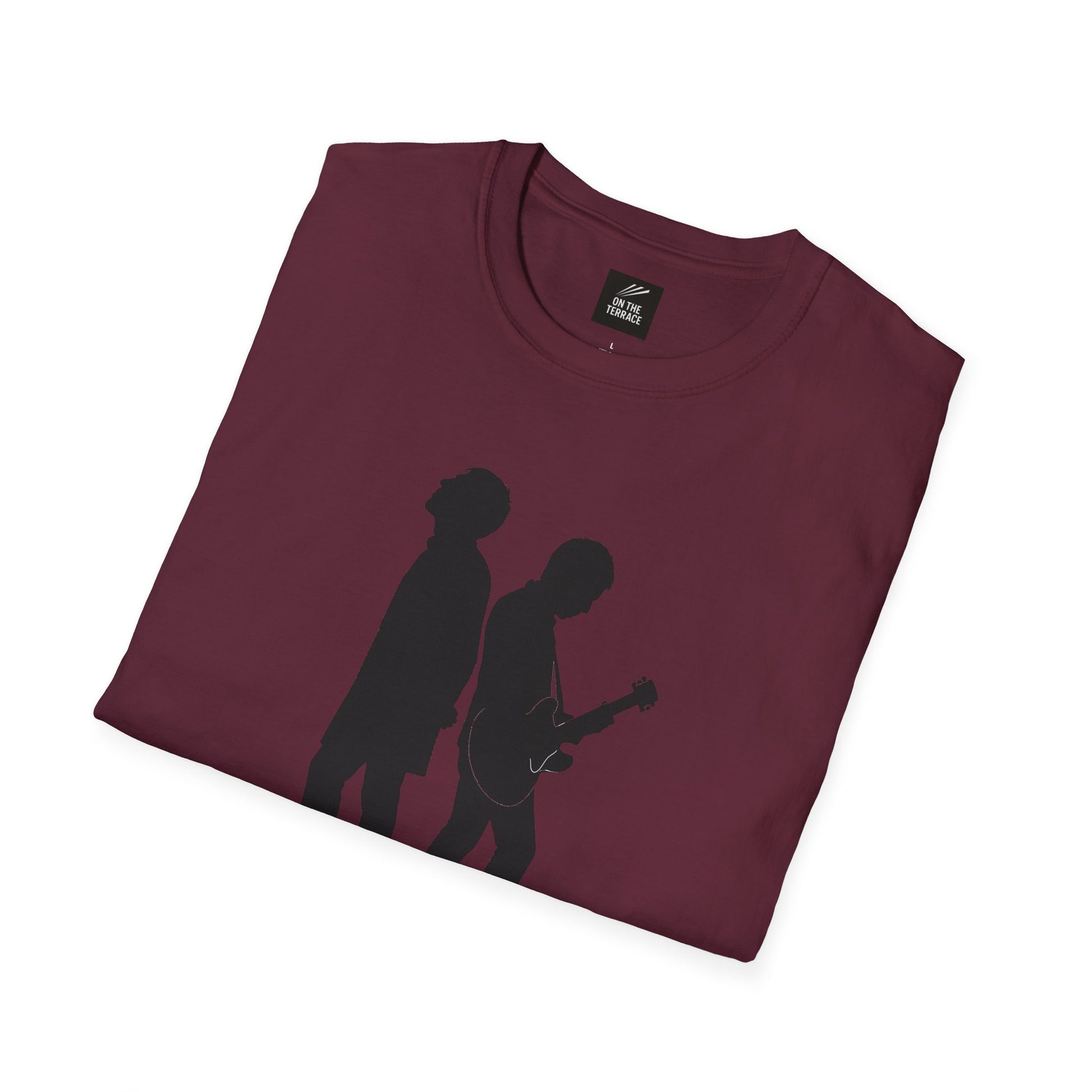 Folded maroon t-shirt featuring black silhouette of two musicians, one with guitar, on front