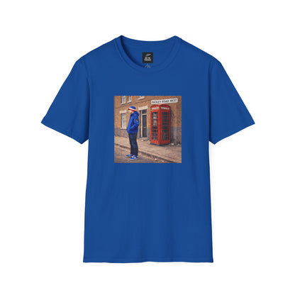Blue t-shirt with a printed design of a person by a red phone box on a white background