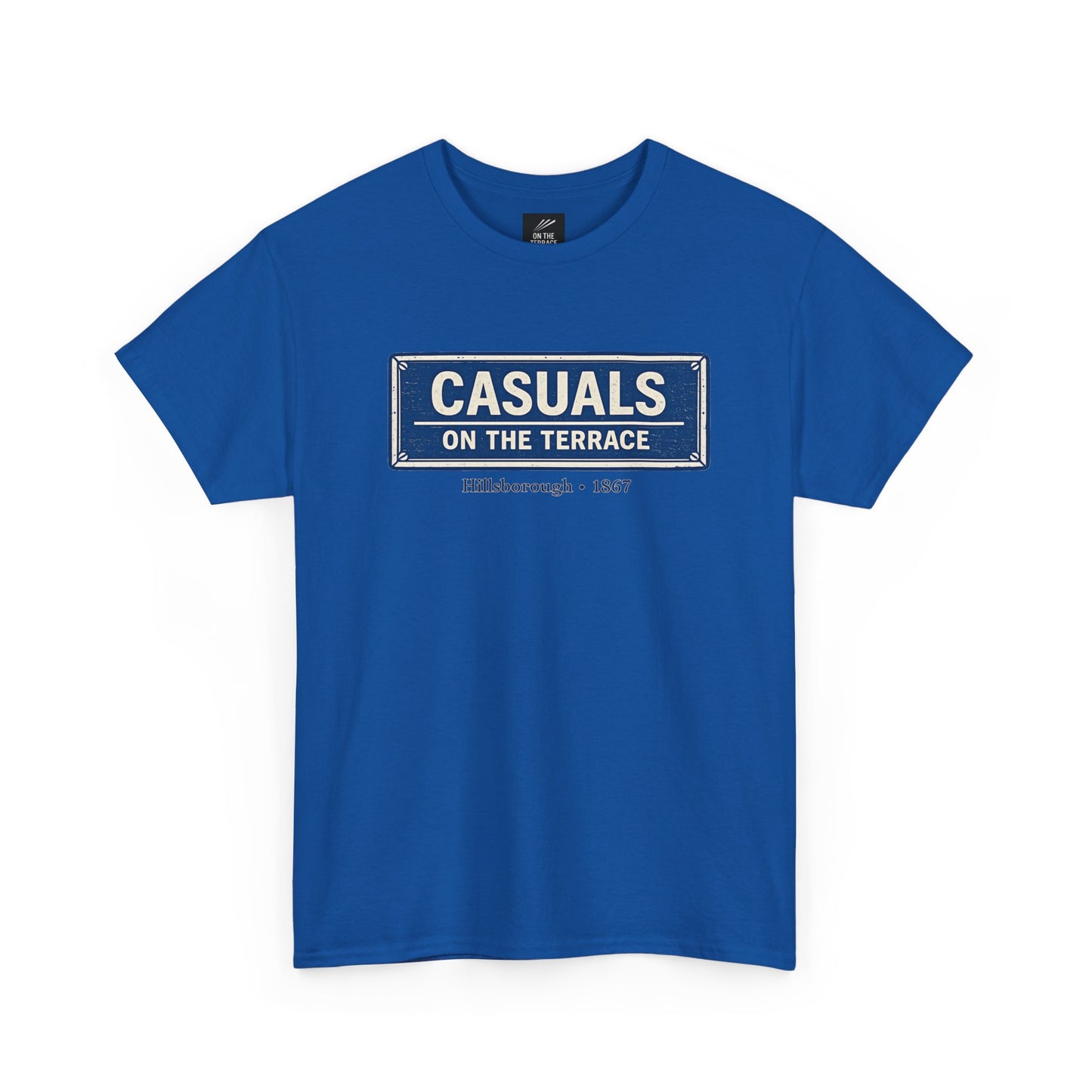 A a royal blue heavy cotton  SWFC t-shirt flat lay featuring a central vintage blue and white street sign graphic reading "CASUALS ON THE TERRACE" with "Hillsborough • 1867" printed below, and an inner neck label for On The Terrace, shown on a plain white background.