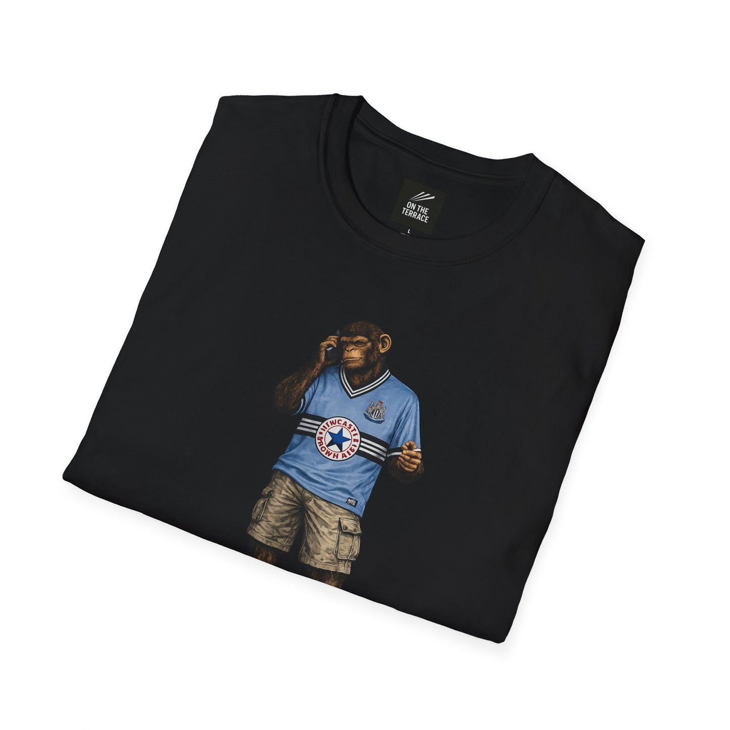 a black Newcastle Northern Monkeys t-shirt with a graphic design of a bear in a Newcastle shirt and shorts