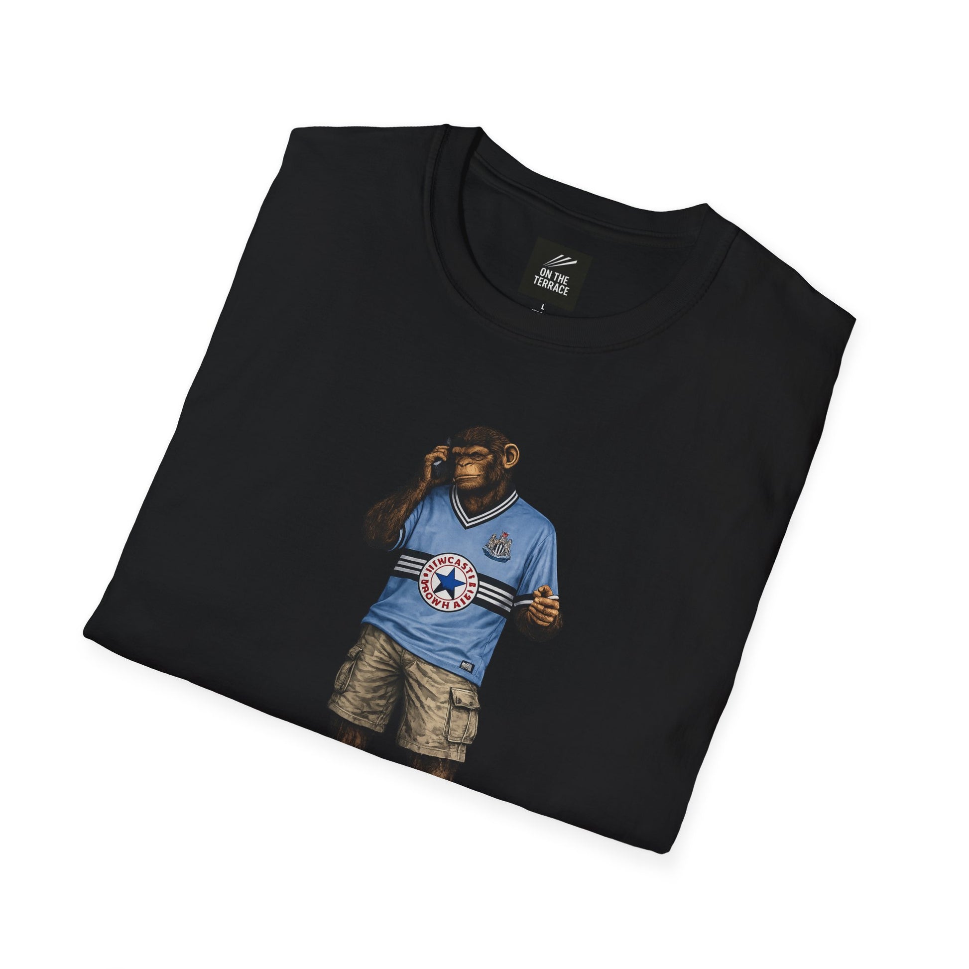 a black Newcastle Northern Monkeys t-shirt with a graphic design of a bear in a Newcastle shirt and shorts