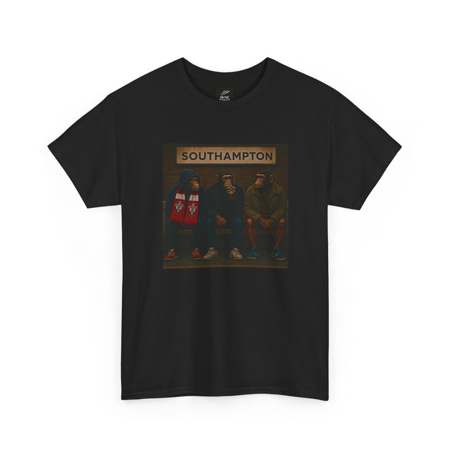 A black short-sleeve crewneck Southampton t-shirt featuring a central graphic print of three hooded figures sitting in front of a sign that reads 'SOUTHAMPTON'.