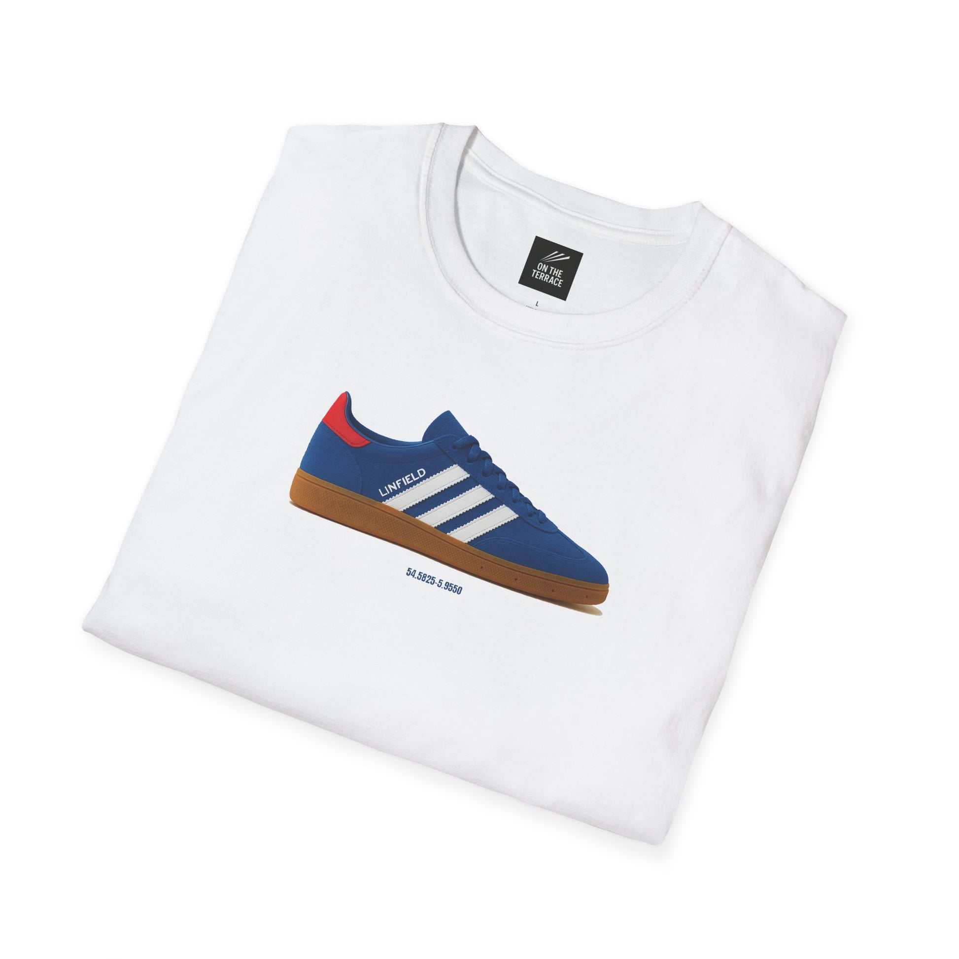White folded t-shirt featuring a blue sneaker graphic with white stripes, red detail, and brown sole