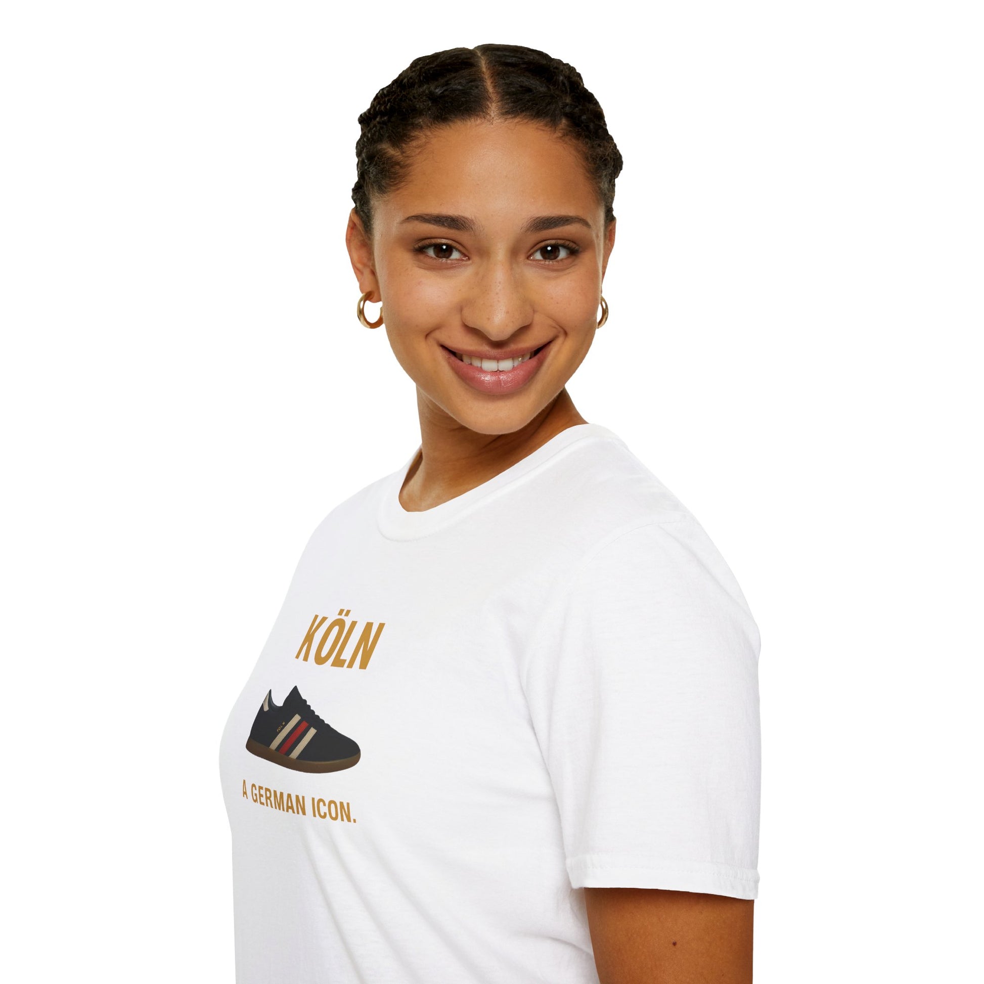 Smiling woman with braided hair wearing gold hoop earrings and white Köln graphic t-shirt