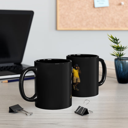 A black ceramic coffee mug featuring a detailed graphic print, showing two chimpanzees dressed in retro Sheffield Wednesday football kits; one wears the blue-and-white striped ASDA home shirt, and the other wears a yellow away shirt with a navy bucket hat.