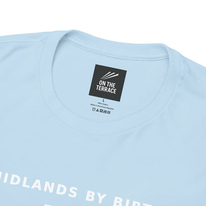 Close-up of the neck label and MIDLANDS BY BIRTH print on the sky blue tee