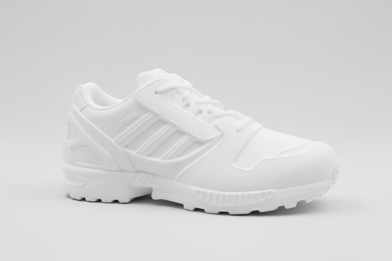White Adidas ZX8000 sneaker on a textured surface