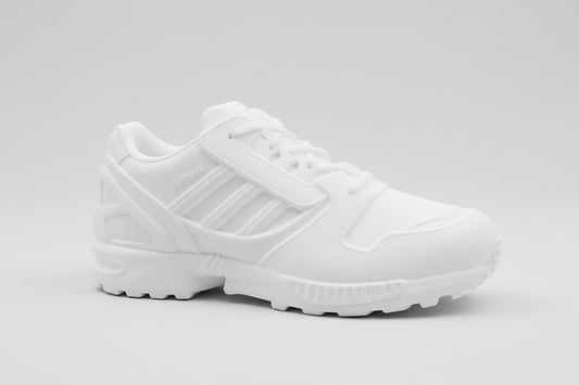 White Adidas ZX8000 sneaker on a textured surface