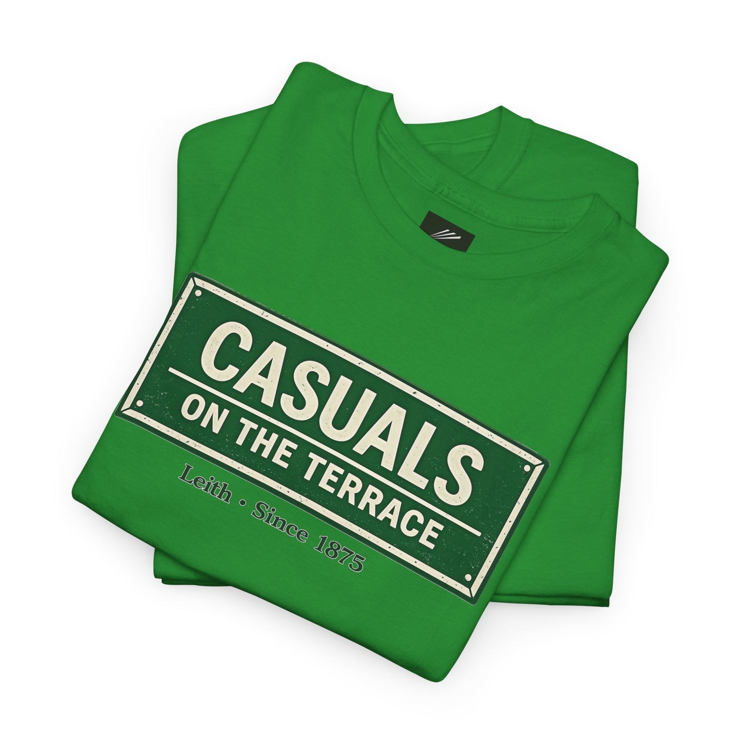 A folded a Hibernian green heavy cotton t-shirt flat lay featuring a central vintage green and white street sign graphic reading "CASUALS ON THE TERRACE" with "Leith • Since 1875" printed below, and an inner neck label for On The Terrace', displayed on a clean white background.
