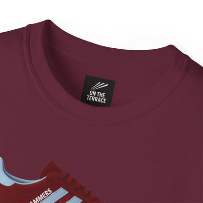 Close-up of maroon crewneck t-shirt collar with On The Terrace label and red sneaker graphic