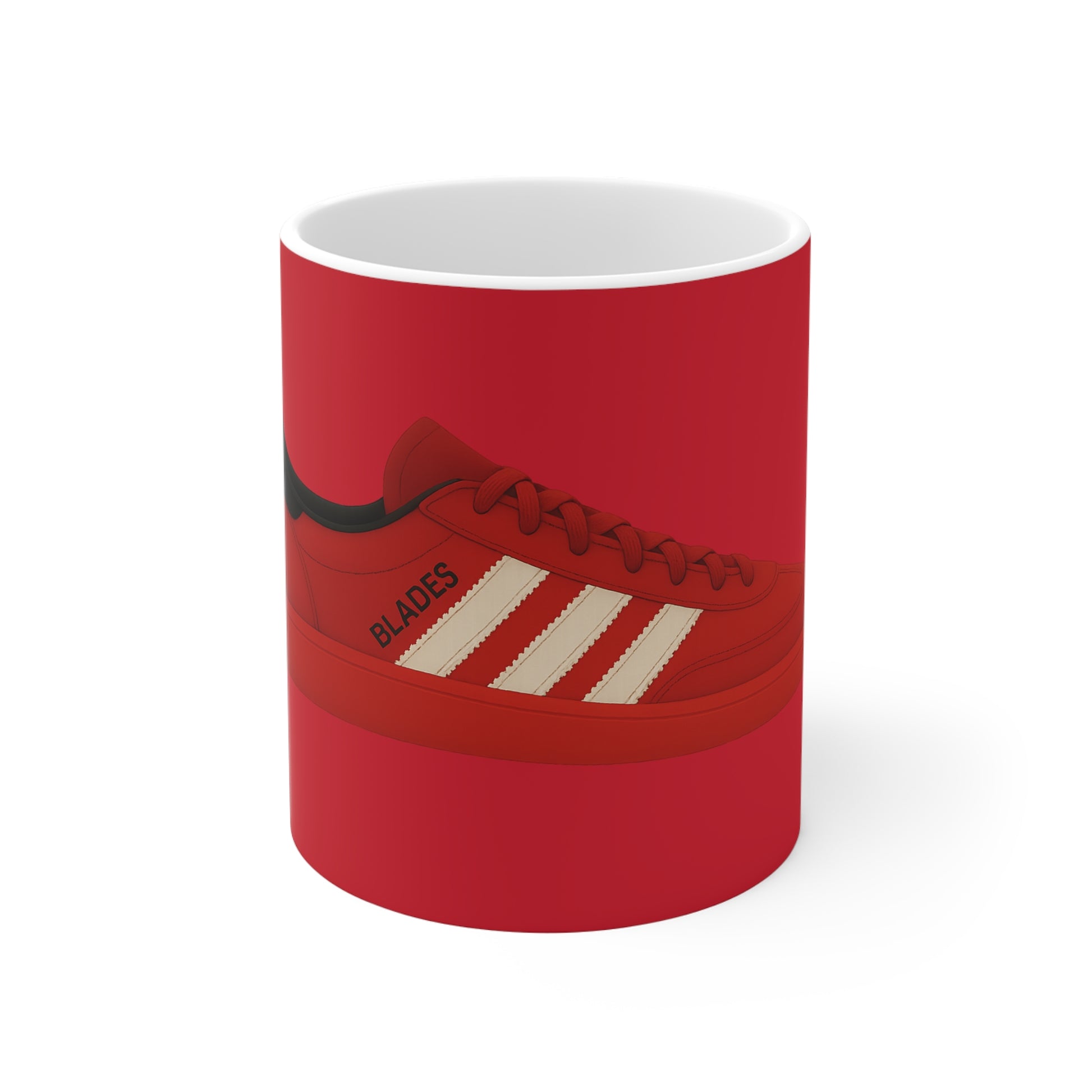 Red ceramic mug featuring illustration of a red sneaker with white stripes and word Blades