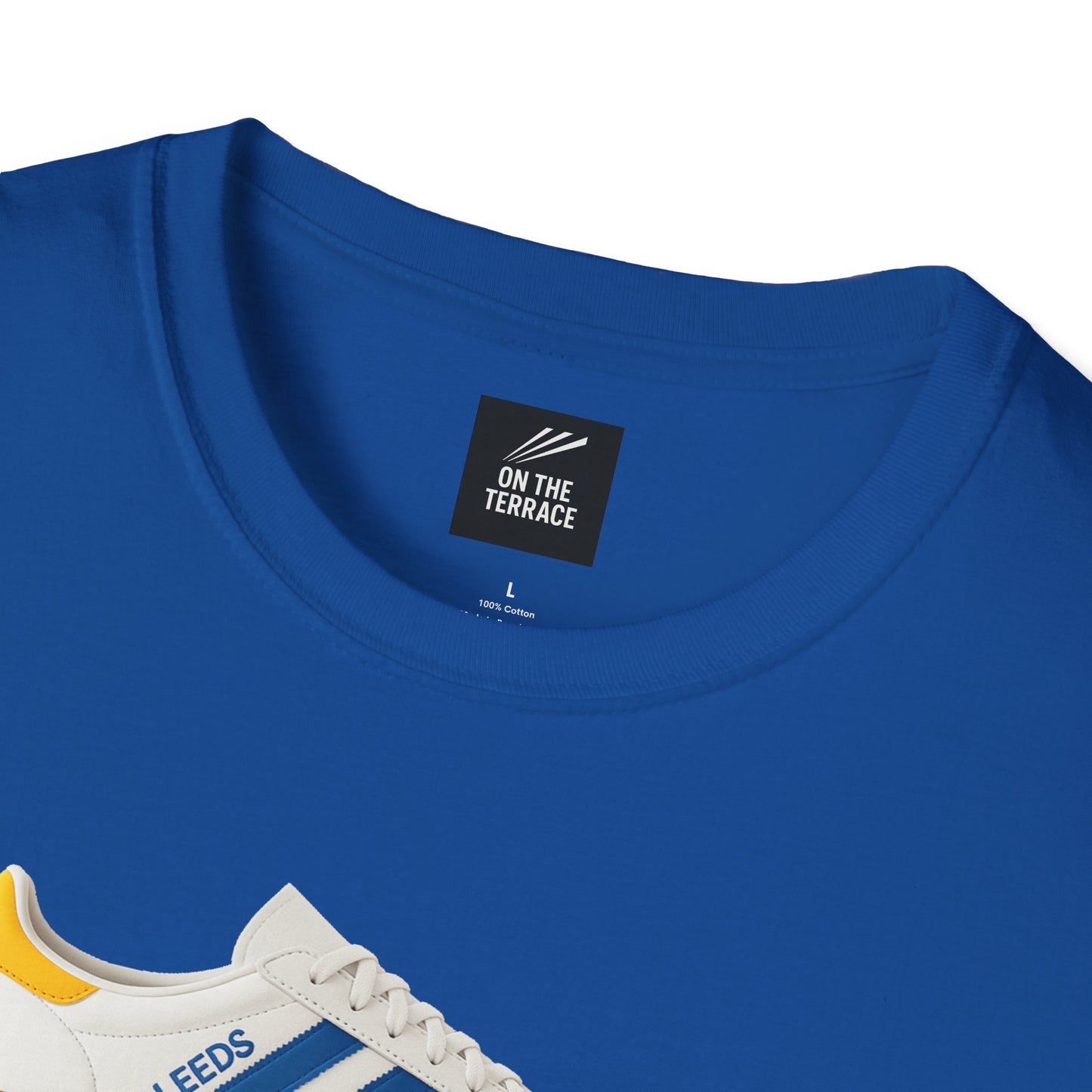 Blue cotton t-shirt with On The Terrace label and partial sneaker print in white, blue, and yellow