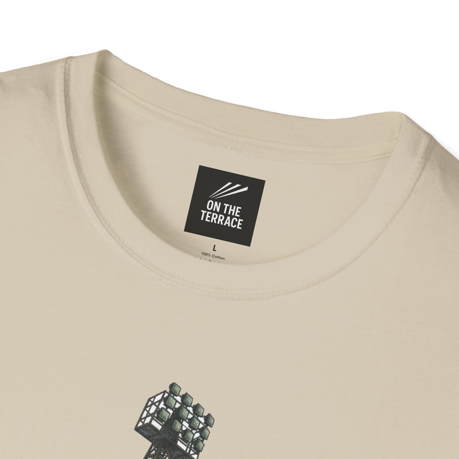 Close-up of beige cotton t-shirt with On The Terrace label and stadium light tower graphic