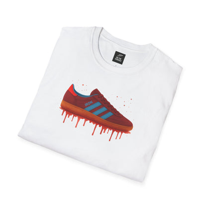 White t-shirt with red and blue trainer graphic and dripping paint effect, folded flat.