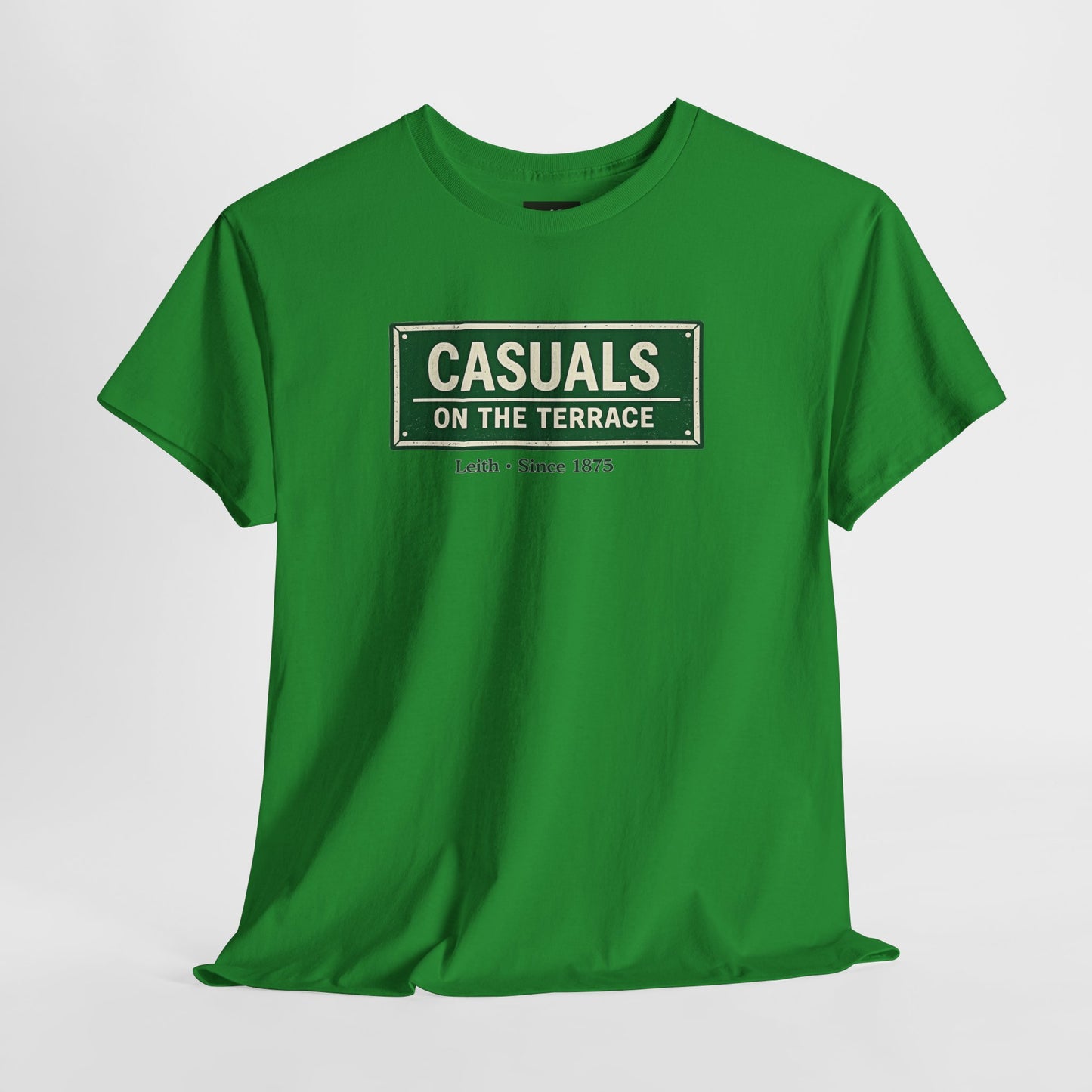 a Hibernian green heavy cotton t-shirt flat lay featuring a central vintage green and white street sign graphic reading "CASUALS ON THE TERRACE" with "Leith • Since 1875" printed below, and an inner neck label for On The Terrace. on a white background