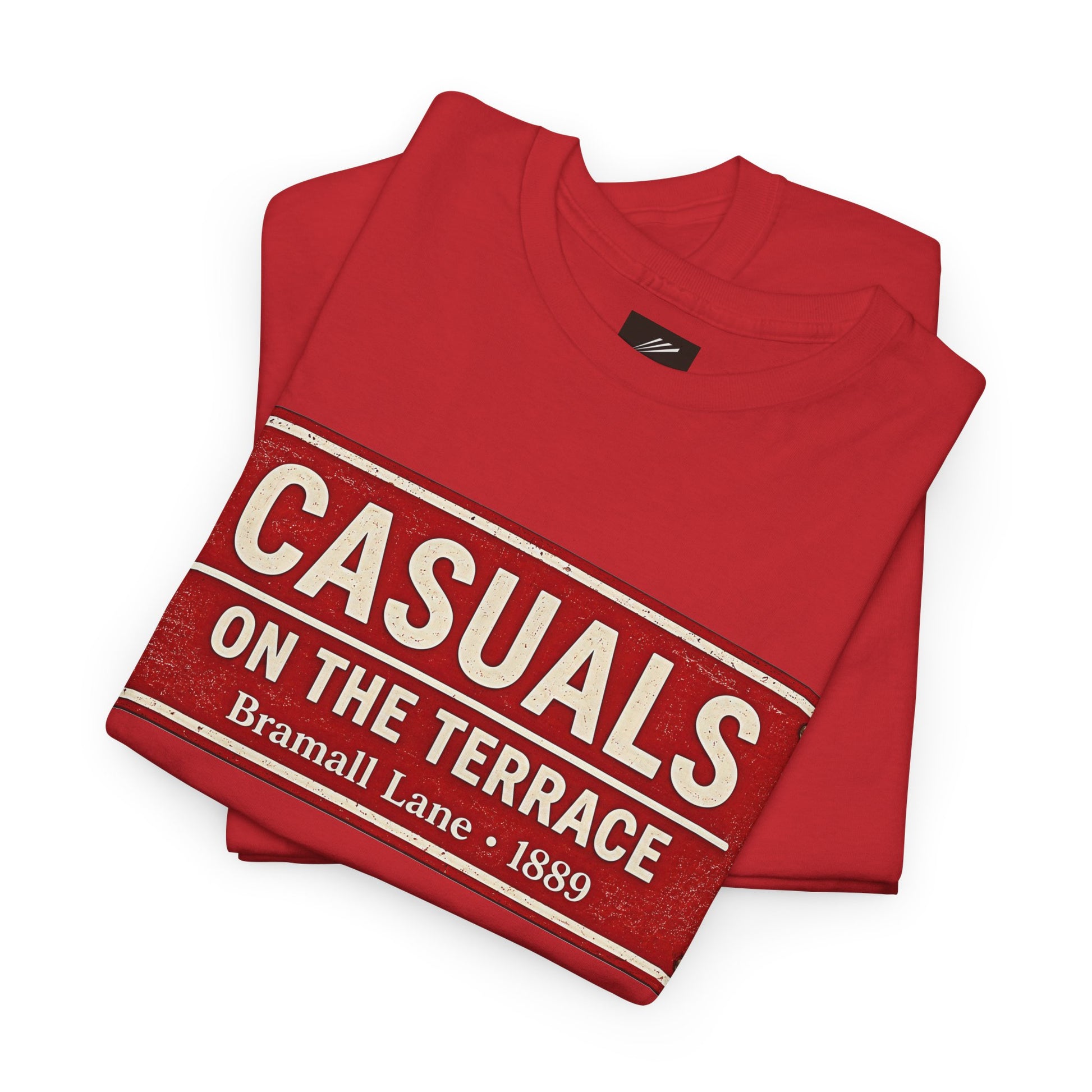 A folded red SUFC t-shirt with a distressed vintage-style graphic that reads 'CASUALS ON THE TERRACE Bramall Lane · 1889' in cream lettering, displayed on a clean white background.