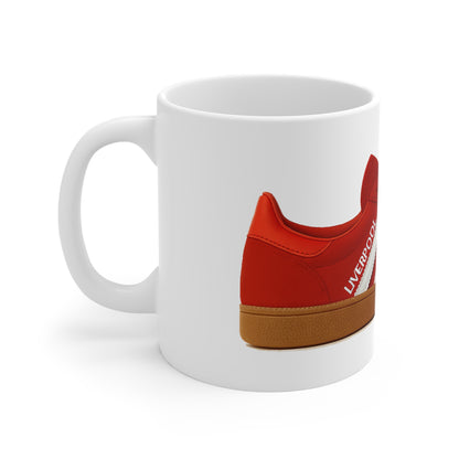 White mug with side print of a red shoe featuring brown sole and white text Liverpool