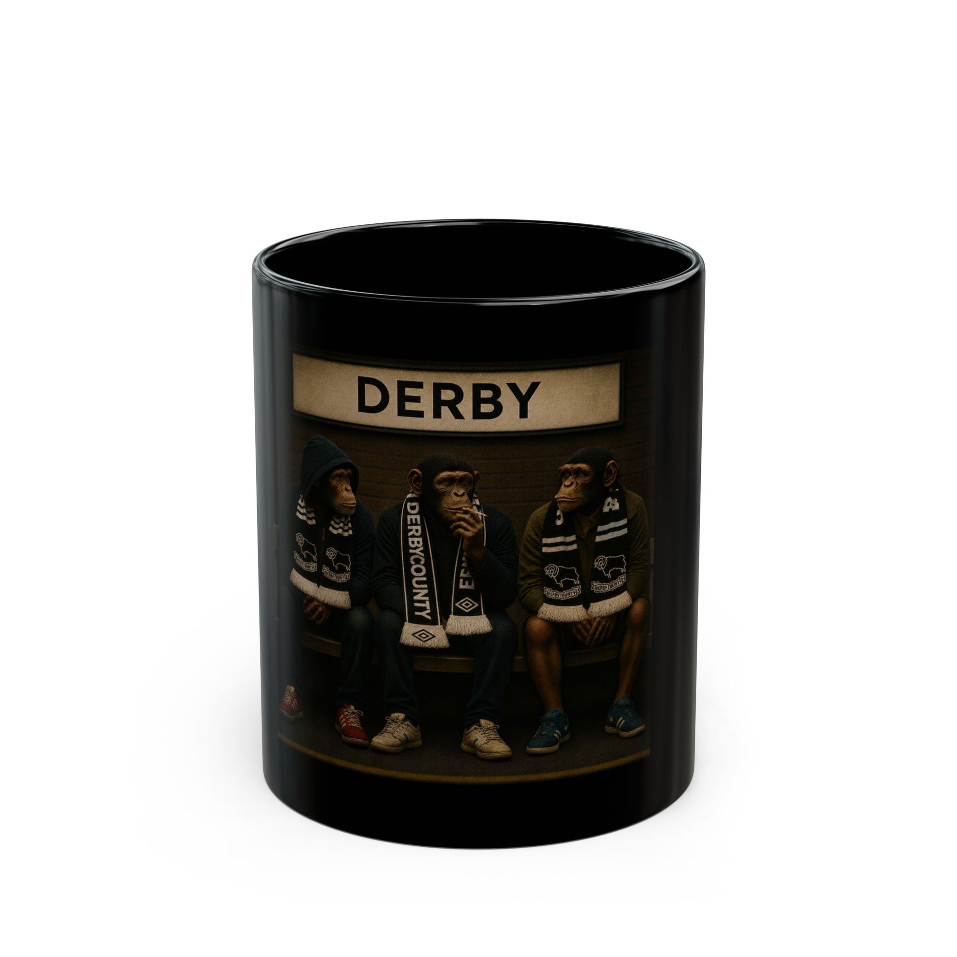 Black mug with 'DERBY' branding and images of people wearing branded clothing on a white background