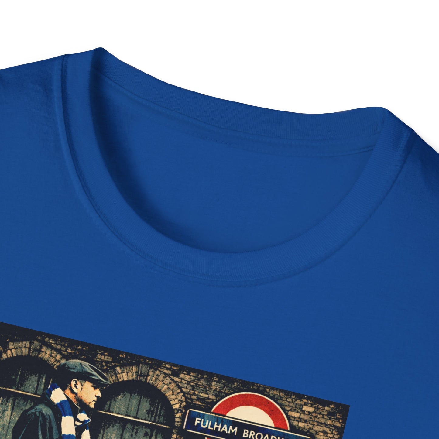 A close up image of a Blue Chelsea T-shirt of a football casual stood outside a tube station on match day near a red telephone box