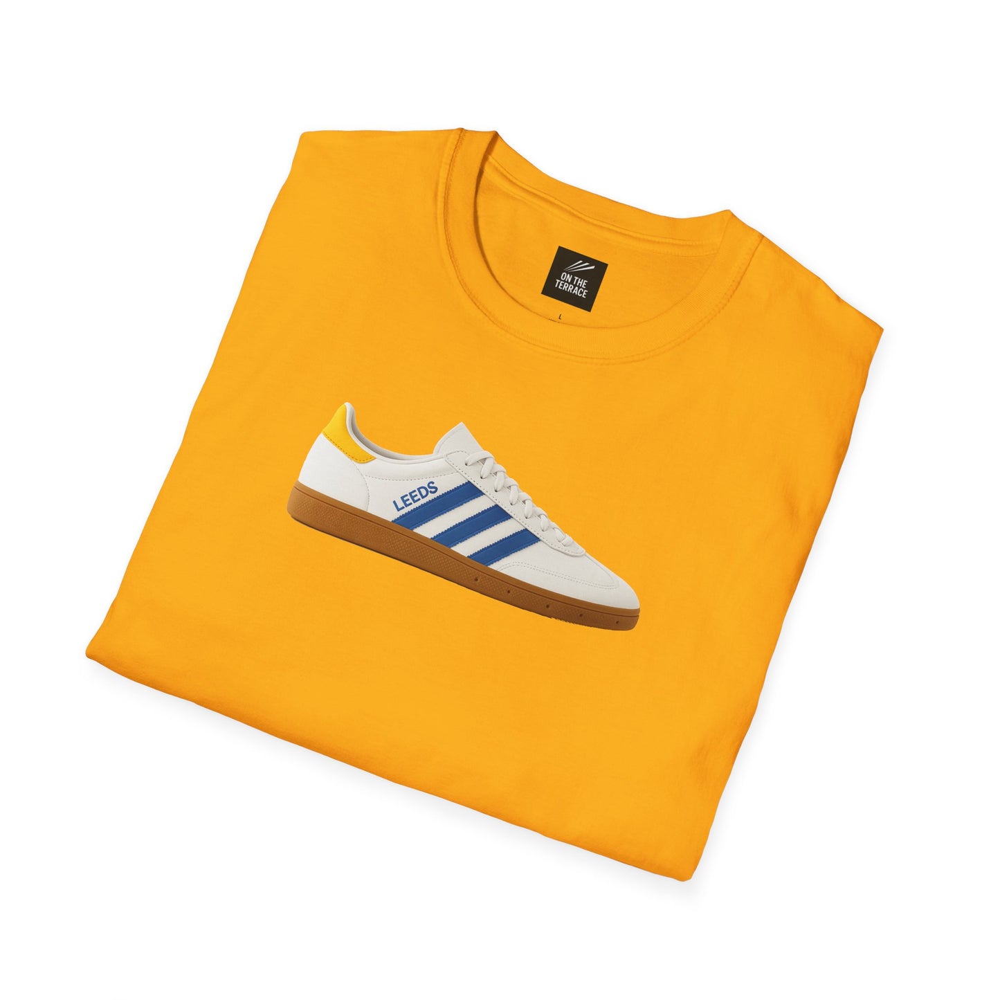 Folded bright yellow t-shirt with a graphic of a white and blue Leeds sneaker on the front