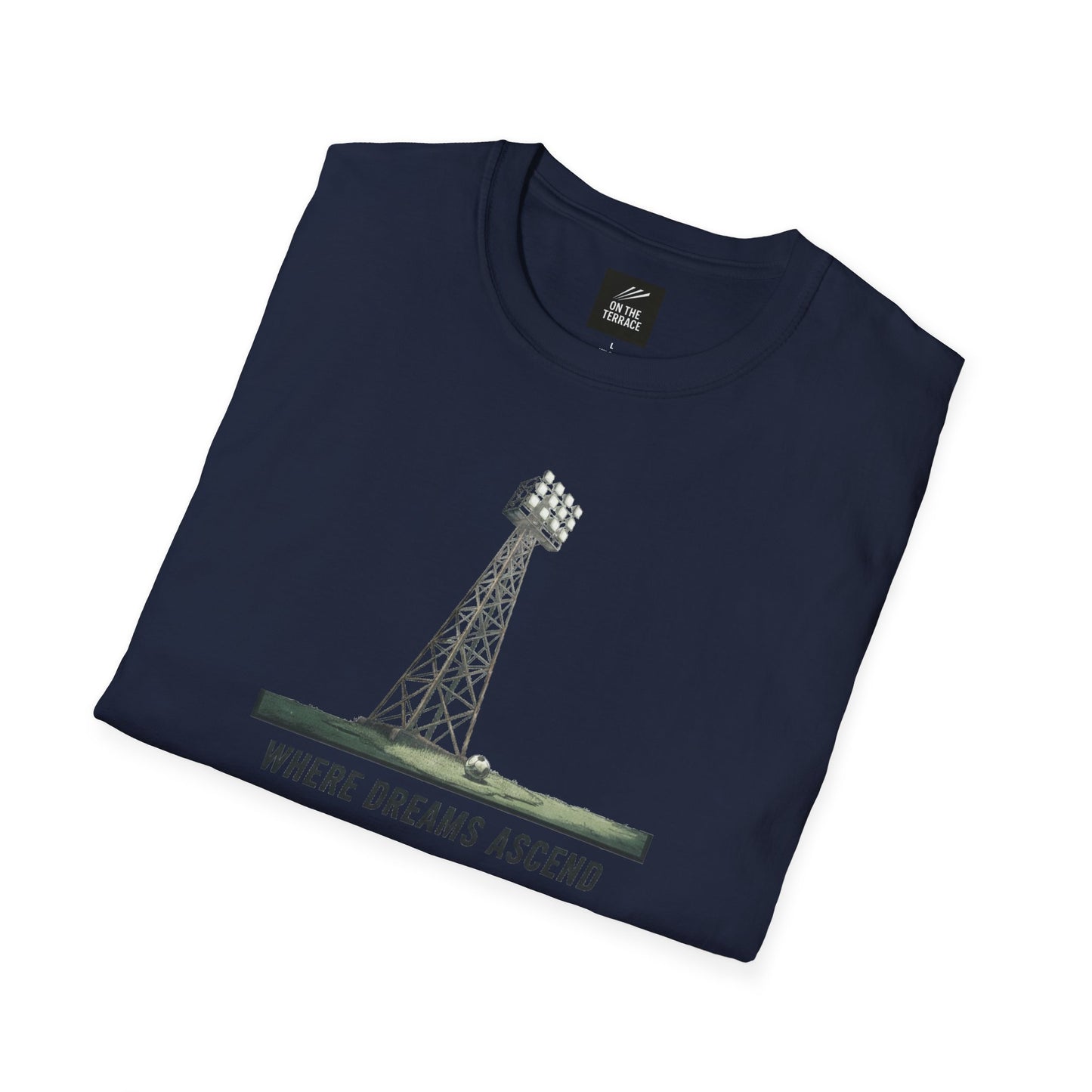 Navy blue folded t-shirt with soccer stadium floodlight tower and text Where Dreams Ascend
