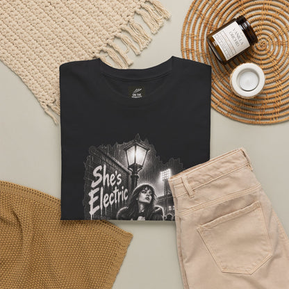 Black Oasis She's Electric tee flat lay with jumper, cord trousers and candle