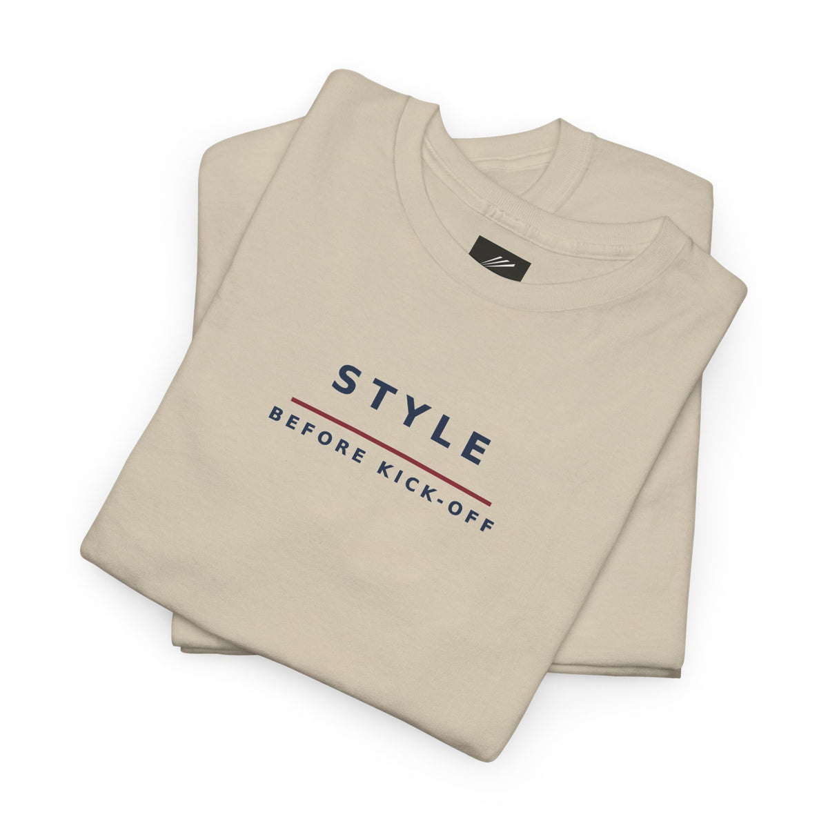 Folded sand T-shirt showing Style Before Kick-Off slogan in navy