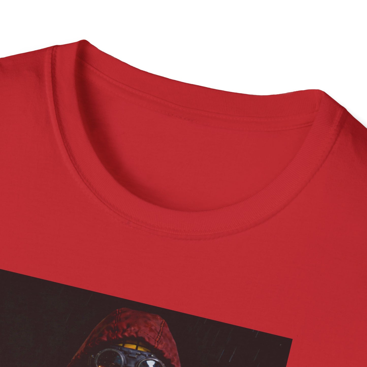 Close up Red Man United t-shirt featuring a man in a hooded jacket with goggles and a yellow mask, football casual style