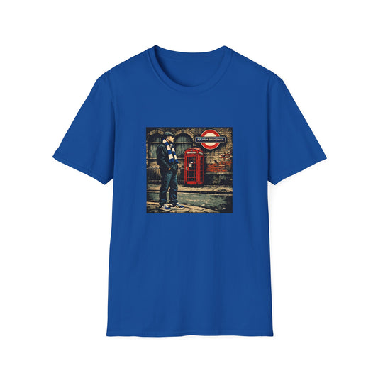 Blue t-shirt with a graphic of a man by a red phone box and London Underground sign on a white background.