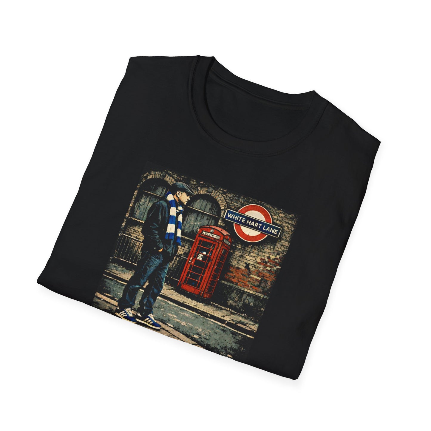 Folded Black Spurs t-shirt with graphic of football casual man standing near red phone booth and White Hart Lane sign