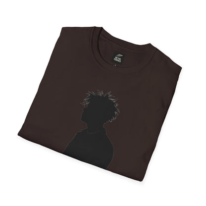 Folded dark brown t-shirt with black silhouette of a person with spiky hair on front