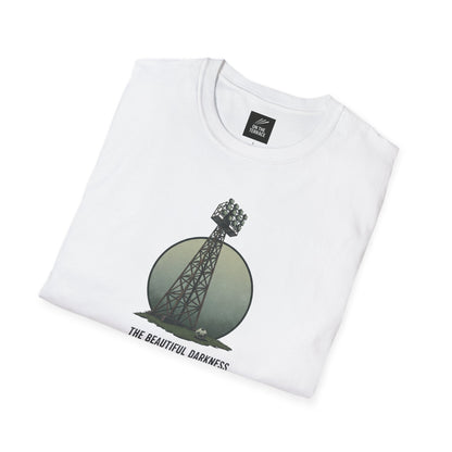 White folded t-shirt with a stadium floodlight tower, soccer ball, and text The Beautiful Darkness