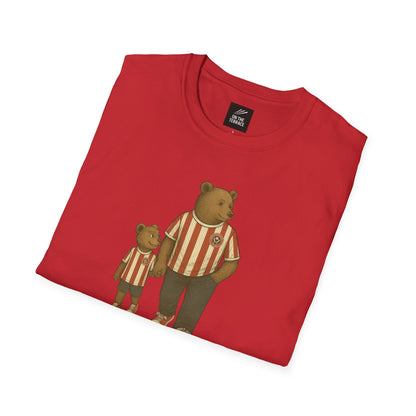 Folded red t-shirt with bear graphics on a white background