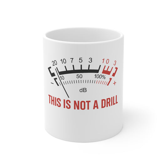 White coffee mug with humorous loudspeaker decibel meter design and text This is not a drill