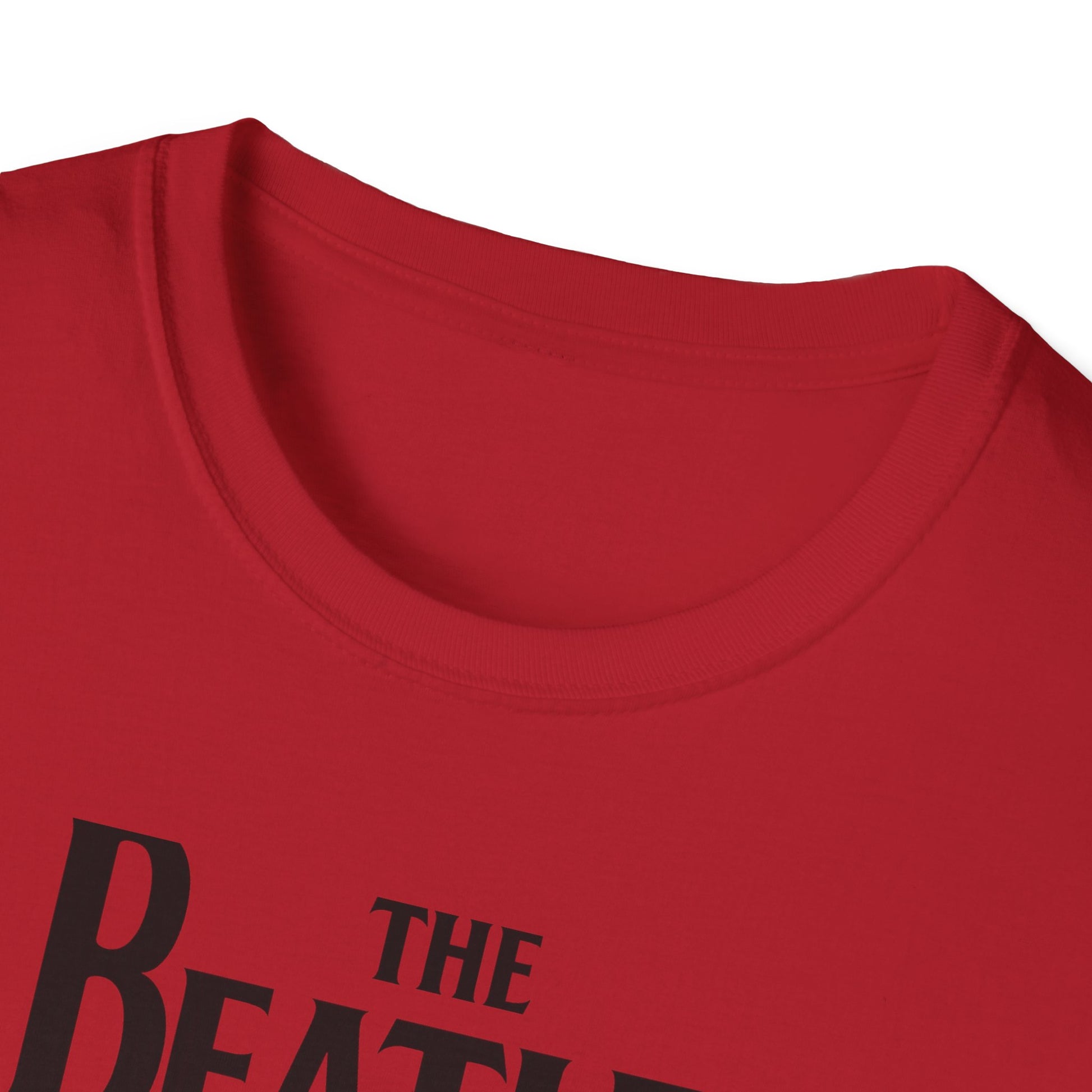 Close up of a t-shirt with 'The Beatles' logo on a white background