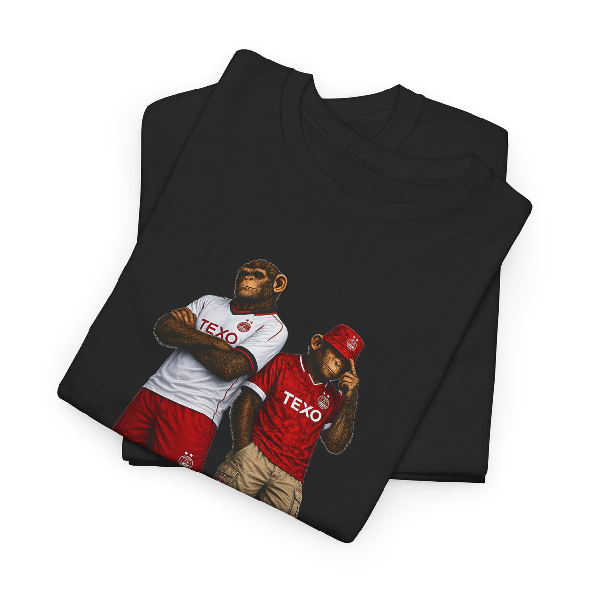 A folded black t-shirt featuring a graphic print of two apes dressed in Aberdeen  jerseys with 'TEXO' printed on the front, set against a plain white background.