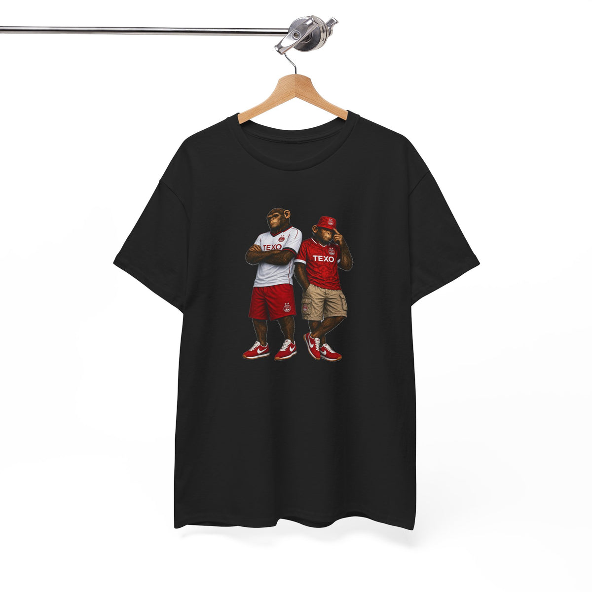 A black short-sleeve t-shirt hanging on a wooden hanger from a metal rod, featuring a graphic print of two Aberdeen fans on the front.