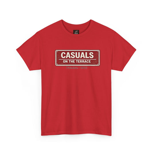 A red heavy cotton Aberdeen t-shirt flat lay featuring a central vintage red and white street sign graphic reading "CASUALS ON THE TERRACE" with "Pittodrie • 1903" printed below, and an inner neck label for On The Terrace., displayed on a clean white background.