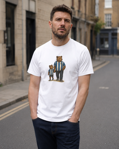 Man wearing the white Sheffield Wednesday Dad & Lad T-shirt with blue-and-white bear artwork
