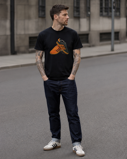 Man wearing the black tee with an orange and gold retro sneaker graphic