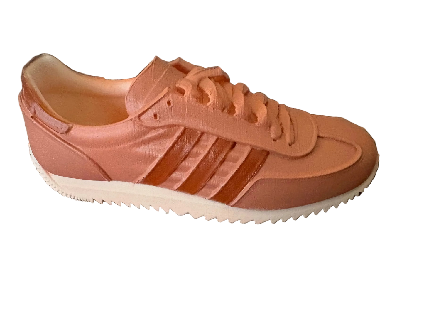 LG Adidas sneaker on a textured surface