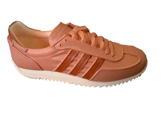 LG Adidas sneaker on a textured surface