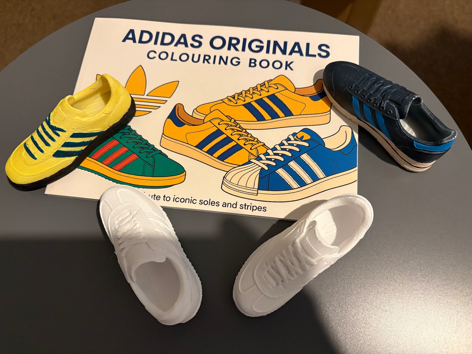 Adidas Originals Colouring Book with iconic sneaker miniatures in vibrant colors.