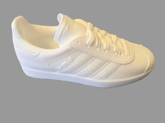 White Adidas Gazelle 3d printed sneaker on a textured gray surface for painting